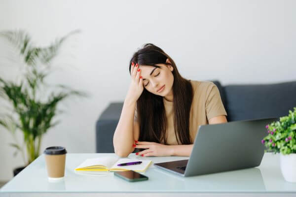 Women at work suffering from anxiety